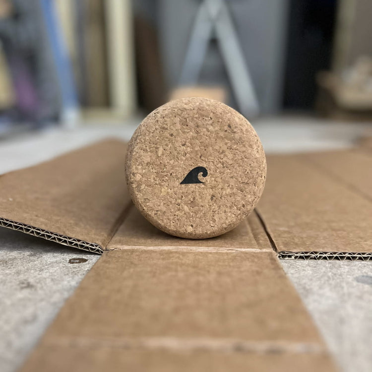 Norst cork roller with the Norst wave logo, resting on its box