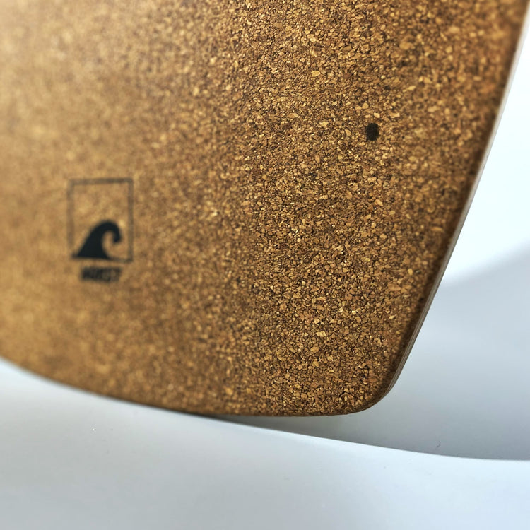 Close-up of the cork deck of a Norst board with the Norst wave logo