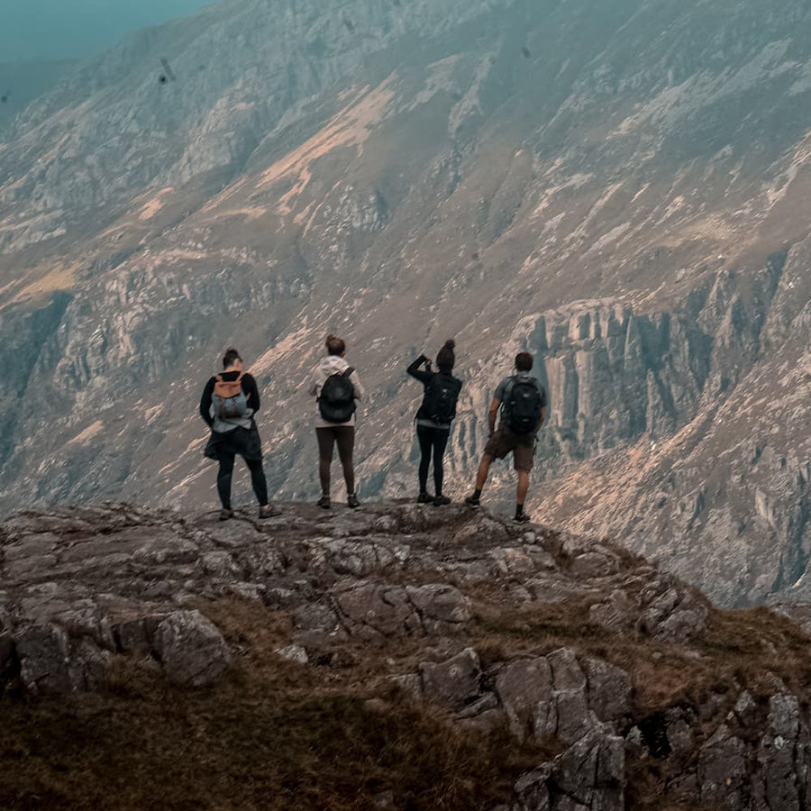 People standing on a mountain ridge